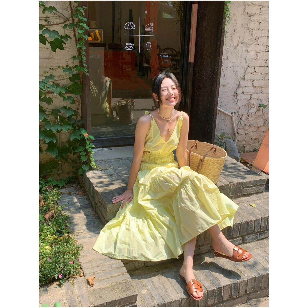 French RIXO COLO dopamine outfit Pale yellow slip dress V neck cutout waist revealing pleated maxi skirt image 0