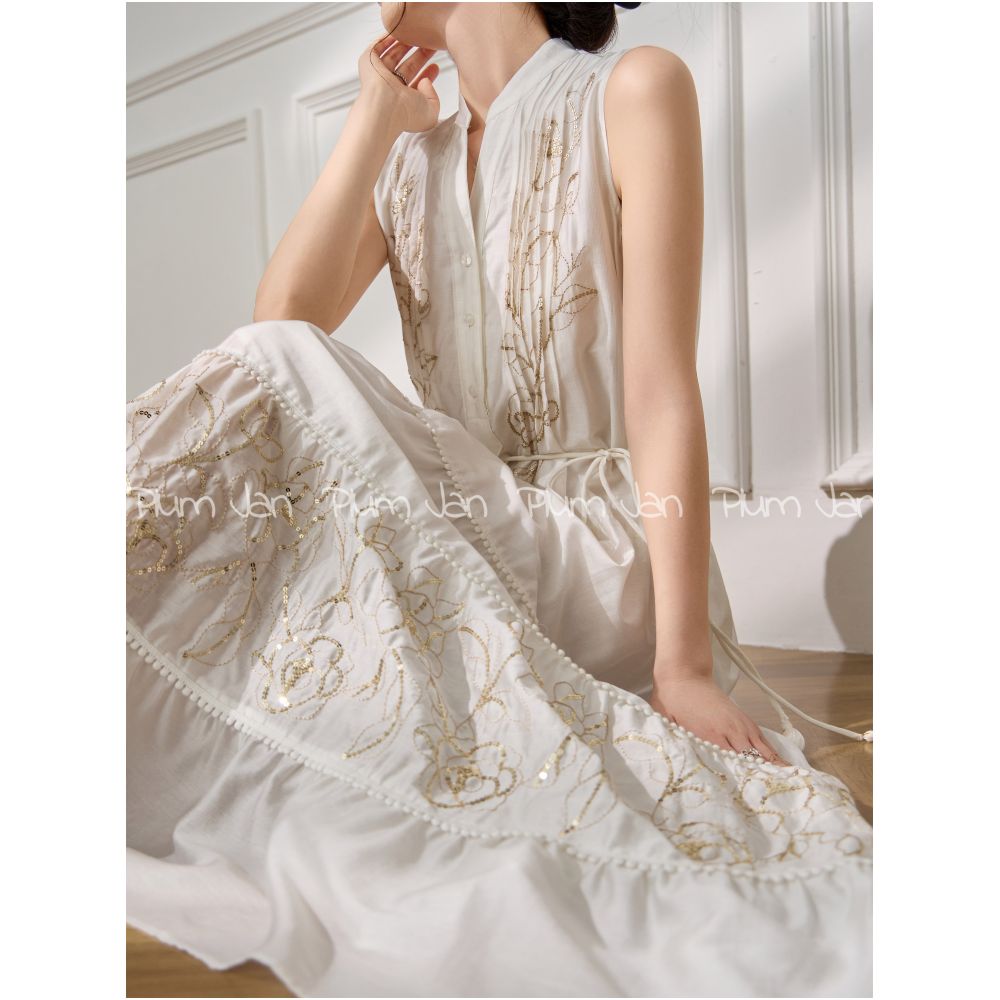 Plum Jan Beach photoshoot outfit off white sleeveless stand neck pleated dress a super pretty dress image 2