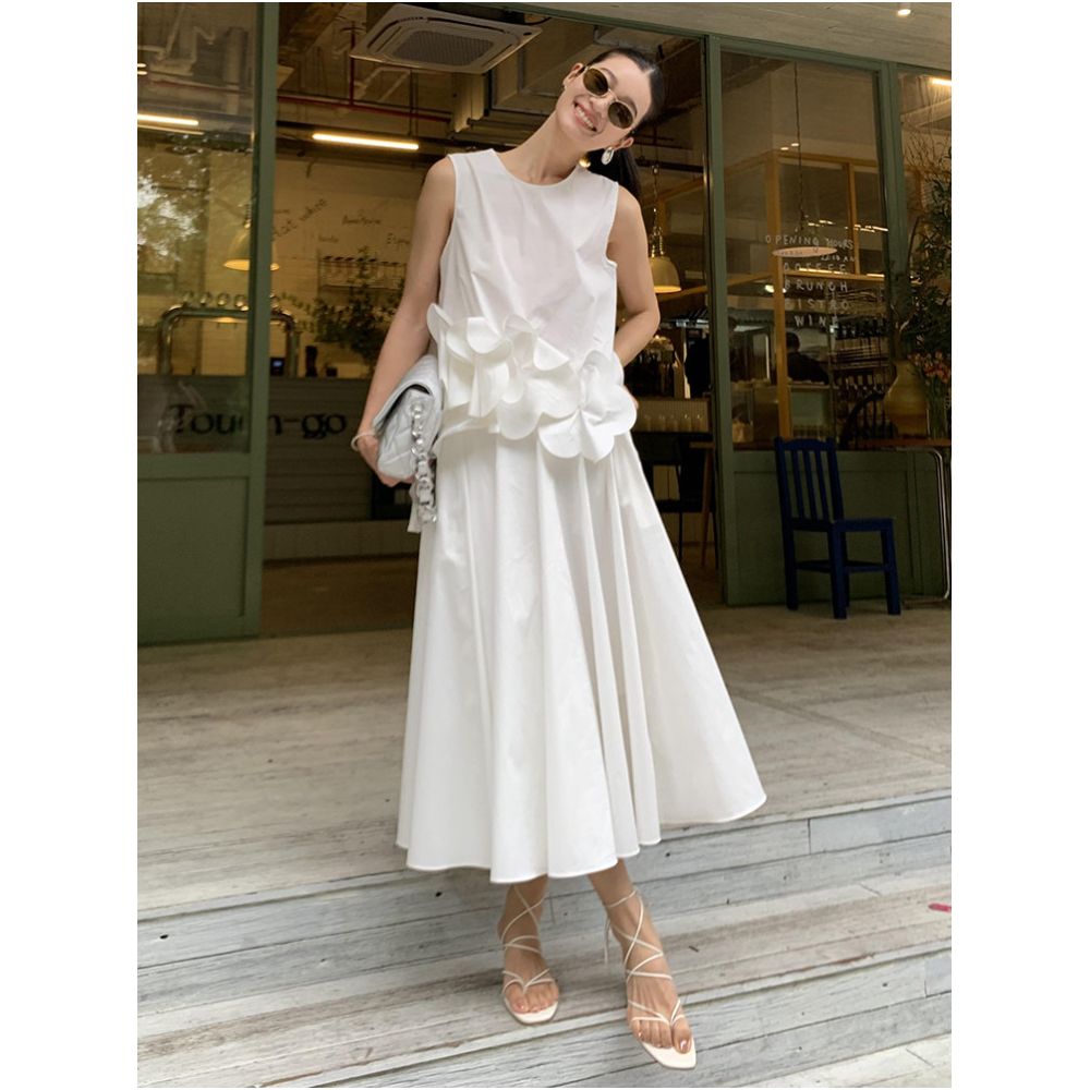 This year s trendy and stylish summer outfits for women include a super cute white sleeveless 3D floral vest and skirt image 0