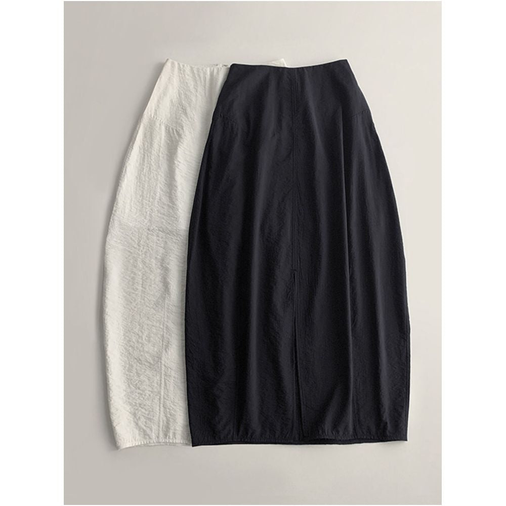 Minimalist stylish loose fitting high waisted slimming versatile silk curved midi skirt with light pleats and a slit design image 1