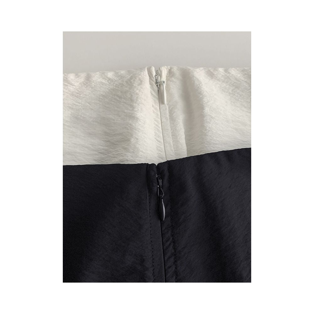 Minimalist stylish loose fitting high waisted slimming versatile silk curved midi skirt with light pleats and a slit design image 2