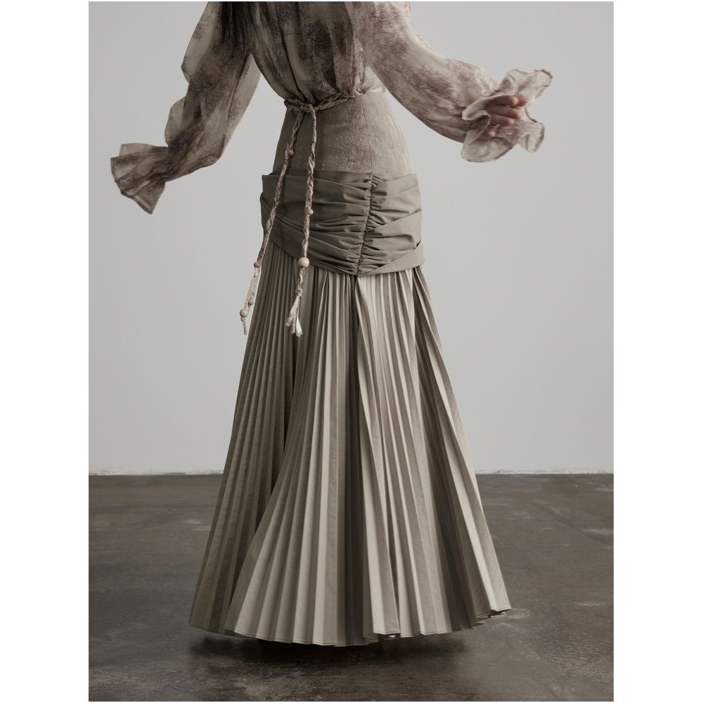 INDULGE Gong Shan A line midi skirt with a unique deconstructed design featuring an irregular wide waistband pleated details and tie up cinches image 3